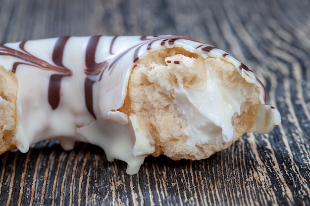 Sweet donut in white chocolate with white filling