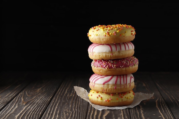 sweet donuts on a wooden background. place for text