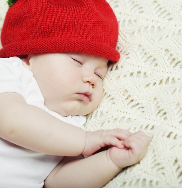 sweet dream of baby in red hat