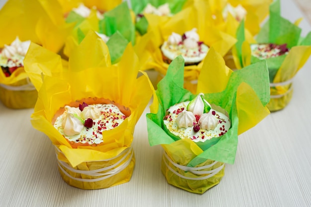 Sweet Easter cakes decorated in yellowgreen paper