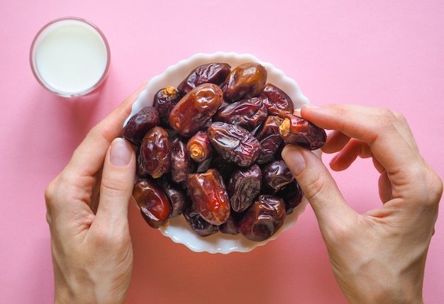 Sweet food for Ramadan. Milk and dates fruit.