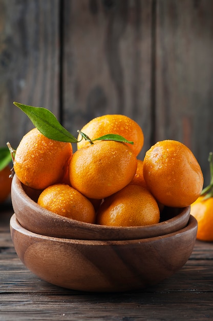 Sweet fresh orange mandarin on the wooden table