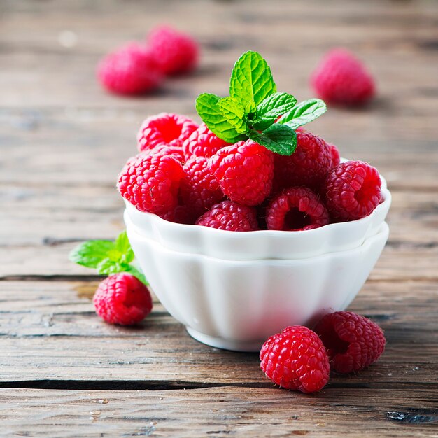 Sweet fresh raspberry and mint in bowl