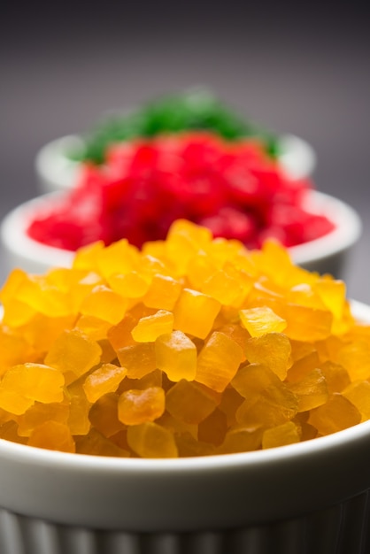 Sweet fruit candy also know as tutti-frutti, candied fruits\
served in a bowl used in masala pan in india or in cakes or\
sweets