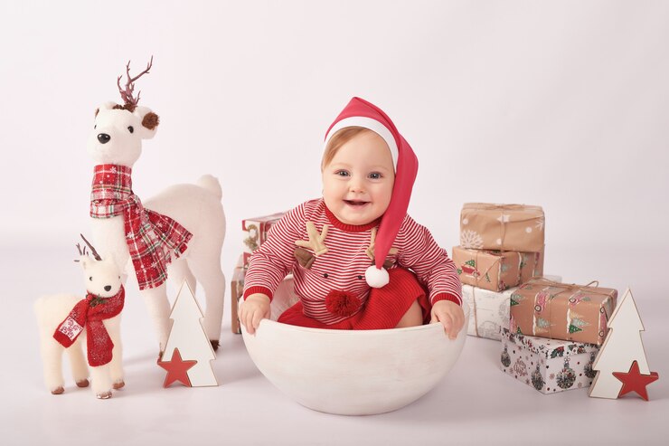 Sweet funny baby in santa hat. Winter holidays. Christmas baby girl.