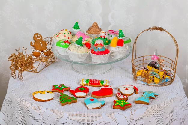 A sweet gifts with homemade cakes cupcakes muffins and gingerbread cookies decorated in a Christmas