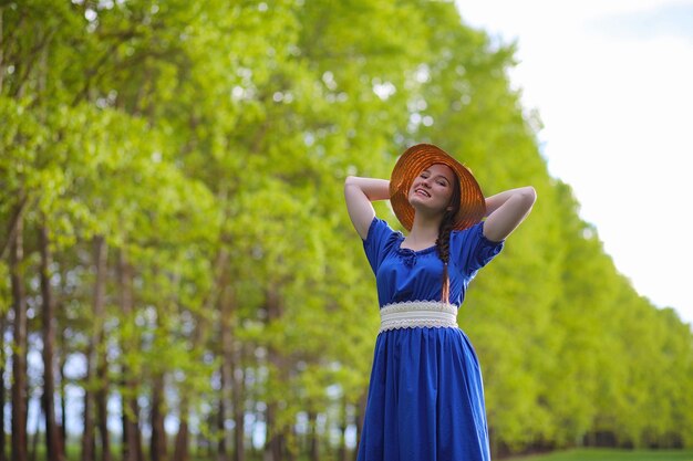 A sweet girl in the countryside on a walk in the sunny evening