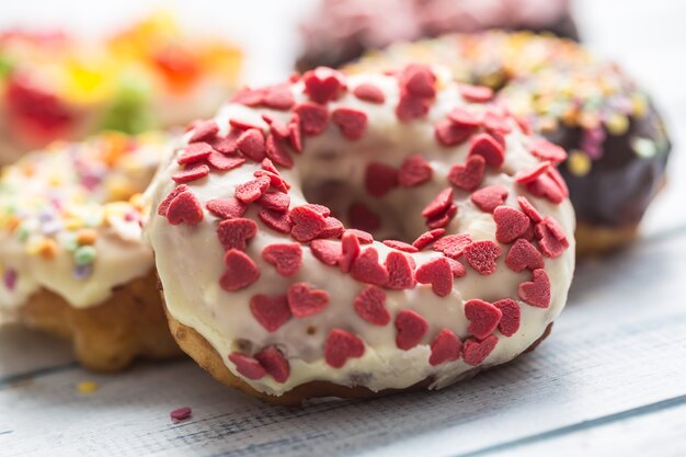 Sweet glazed donuts on table - Close up.