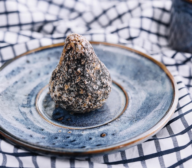 Sweet handmade chocolate truffle on plate