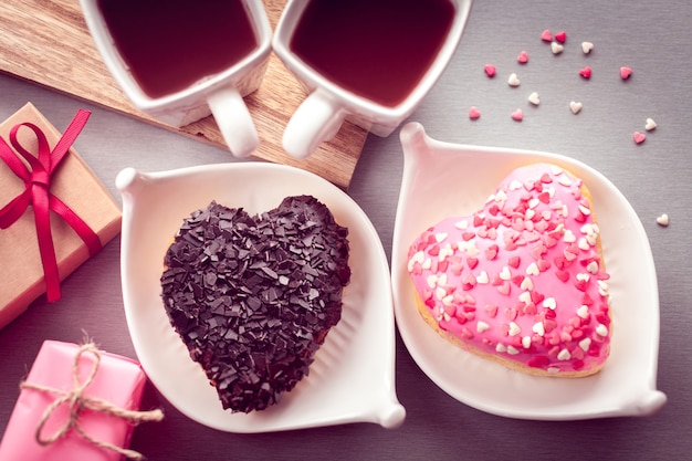 Sweet heart shaped donuts with coffee