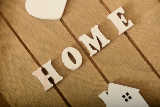 Sweet home sign House wood with heart shape on wooden background