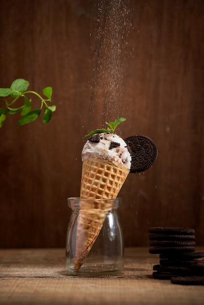 Sweet homemade ice cream with cookies in cone