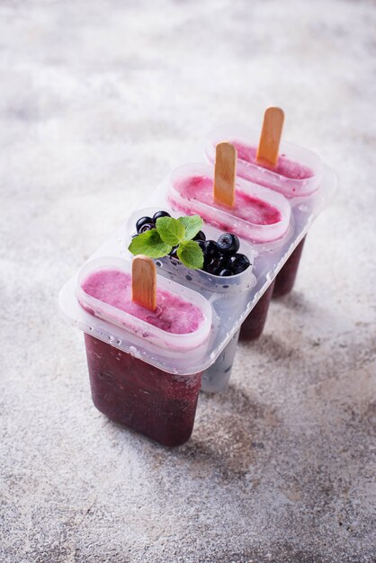 Sweet homemade popsicles with blueberry