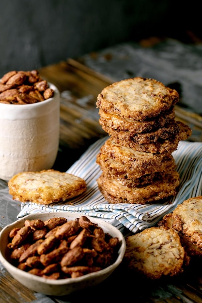 Sweet homemade snacks roasted almond nuts and shortbread cookies