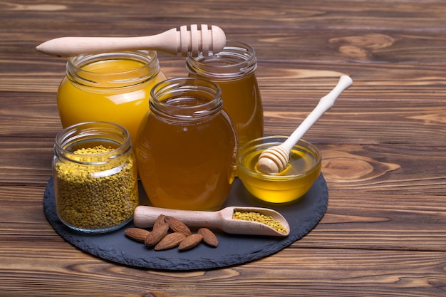 Sweet honey in the glass jar On wood table