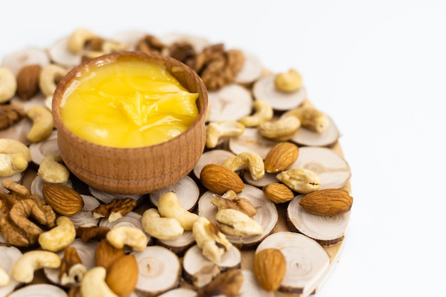 Sweet honey and nuts, isolated on white background.