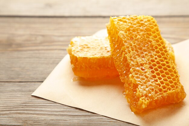 Sweet honeycomb on grey wooden table