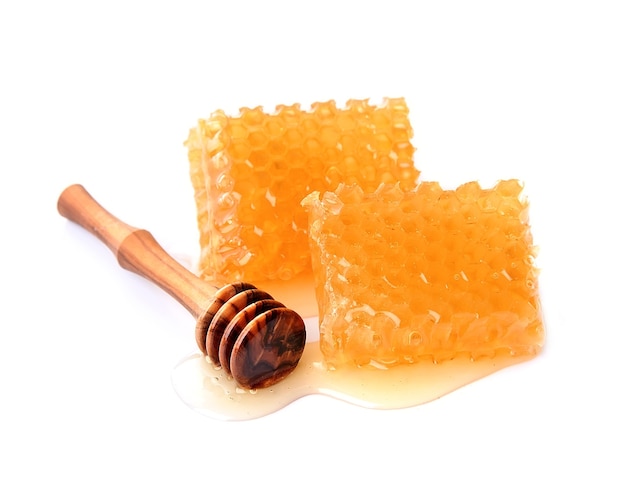 Sweet honeycomb with liguid honey isolated.