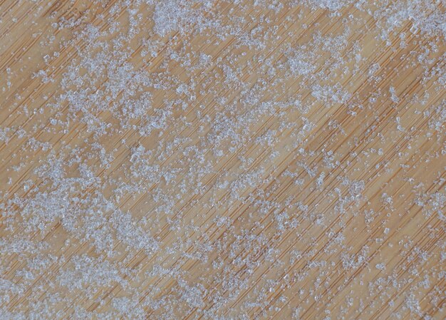 Sweet Indulgence White Sugar Crystals on a Rustic Wooden Background