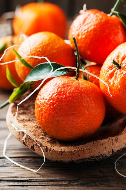 Sweet italian mandarins on the wooden table