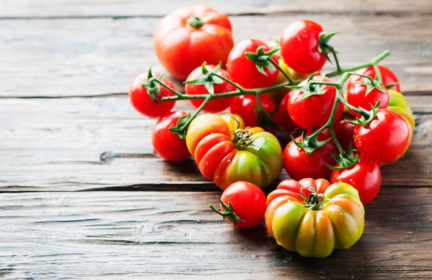 Sweet italian tomatoes on the wooden table