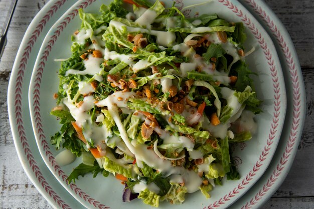 Sweet Kale salad - healthy vegetarian salad with cabbage, eggs, greens, carrots and mayonnaise.