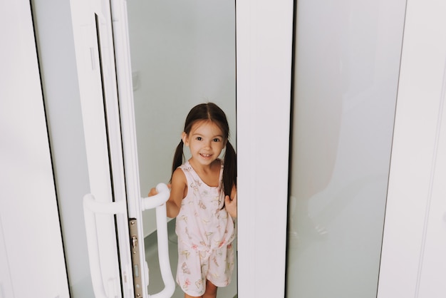 Sweet Little Girl Opening Door Pediatric Clinic.