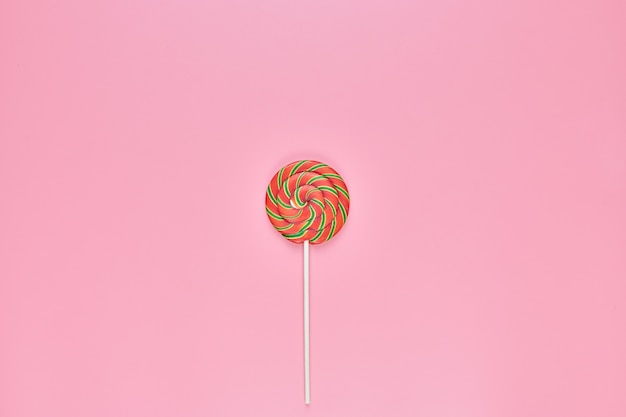 Sweet lollipop on pink background