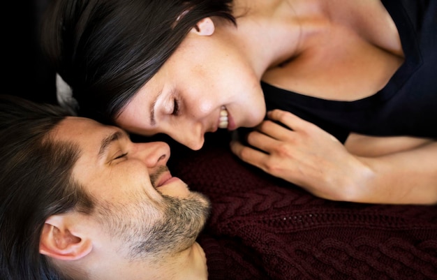 Sweet and loving couple together in bed