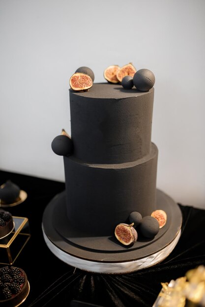 Sweet luxury candy bar on table in restaurant in black tone Cakes and other sweets