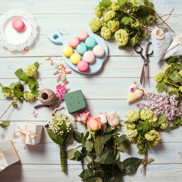 Sweet macarons and flowers - preparation of present