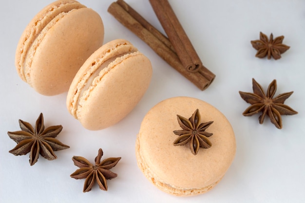 Sweet macarons, spices anise and cinnamon sticks
