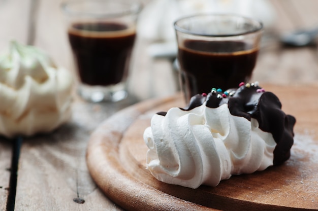 Sweet meringue with cup of italian coffee