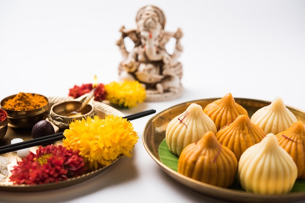 Sweet Modak food offered while Ganapati pooja or Ganesh puja