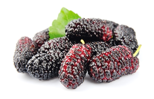 sweet mulberries with  leaves close up blackground
