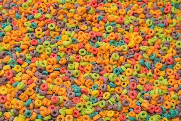 Sweet multicolored flakes, cereal loops as a background..