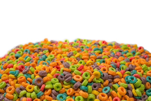 Sweet multicolored flakes, cereal loops. Isolated on a white background.