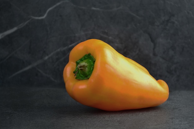 sweet orange pepper on a black table