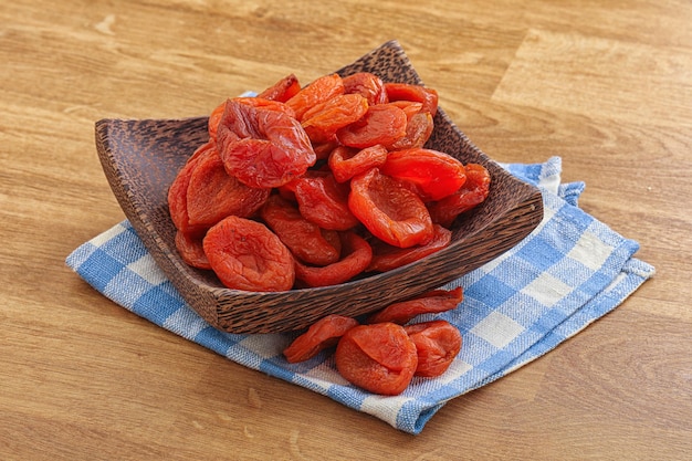 Sweet organic dry apricot snack in the bowl