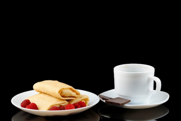 Sweet pancakes with raspberries and coffee