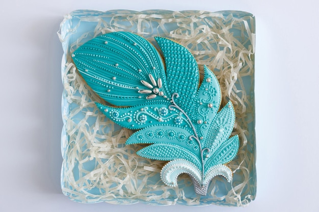 Sweet pastries Dessert for tea Easter gingerbread in form of feather Cookies are in box