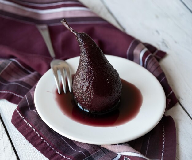 Sweet pear cooked with red wine delicious dessert