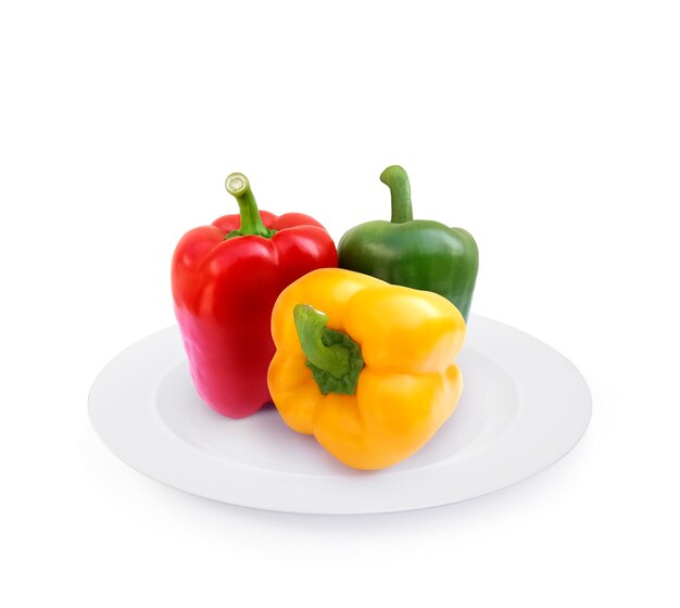 Sweet pepper on plate isolated on white background