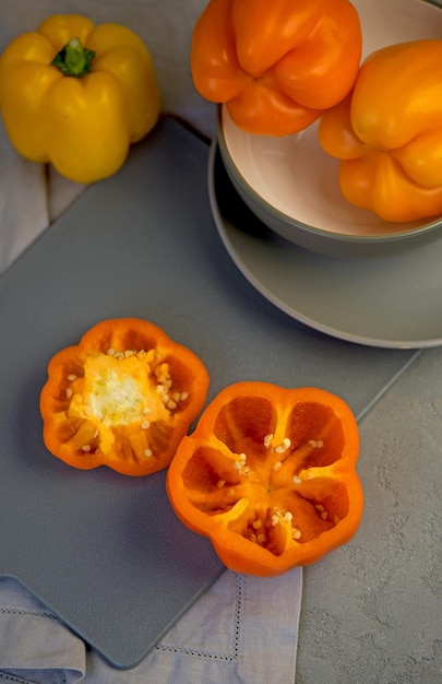 Sweet pepper red orange yellow pepper on a grey background full depth of field