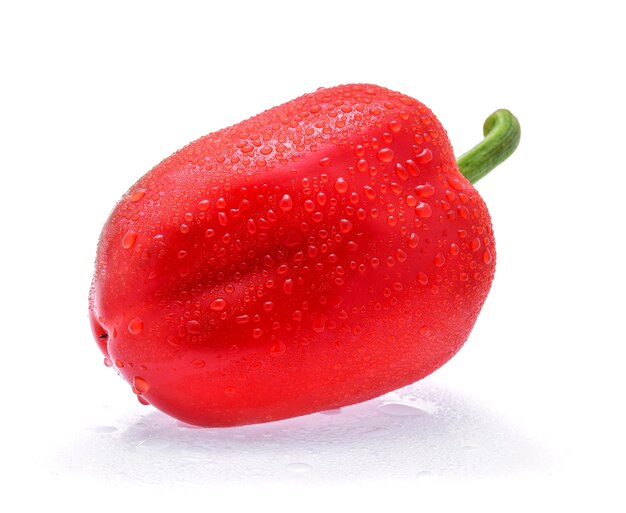 Sweet pepper with drops of water isolated on white.