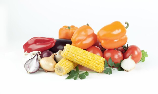 Sweet peppereggplanttomato and cornisolated on a white backgr