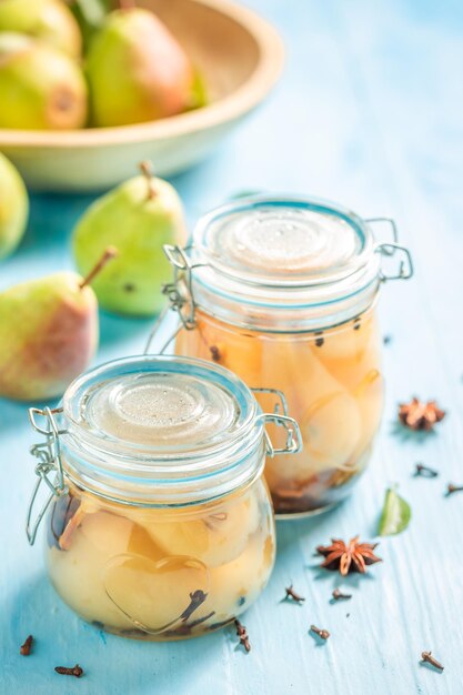 Sweet pickled pears in vinegar with cloves