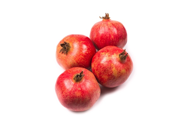 Sweet pomegranate isolated on white surface.