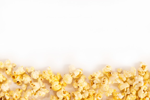 Sweet popcorn on a white background. Copyspace for text.