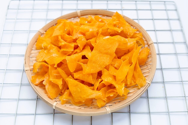 Sweet potato chips on white background.